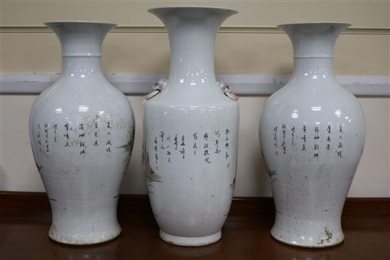 A pair of vases and one other